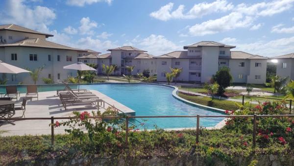 Apartamento no Village dos Ipês em Praia do Forte, Varaa  Bahia hotellit, joissa on uima-allas, Uima-allas